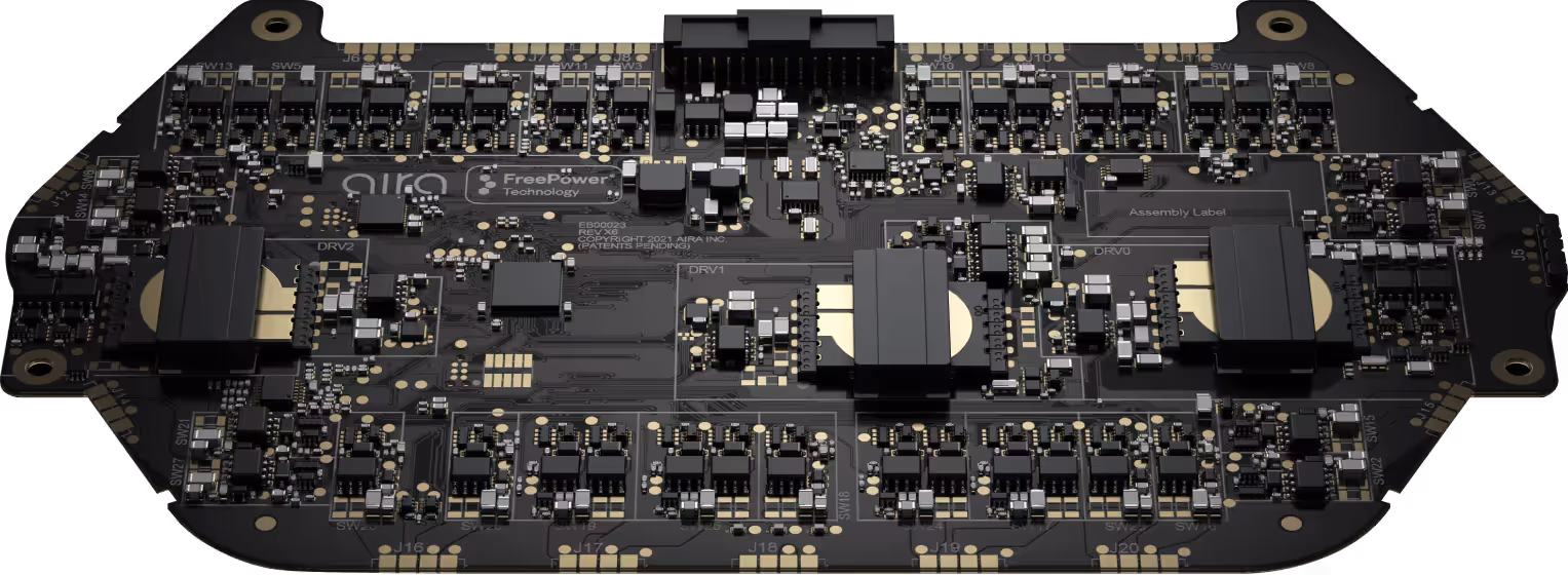 A bare wireless charging circuit board photographed from above