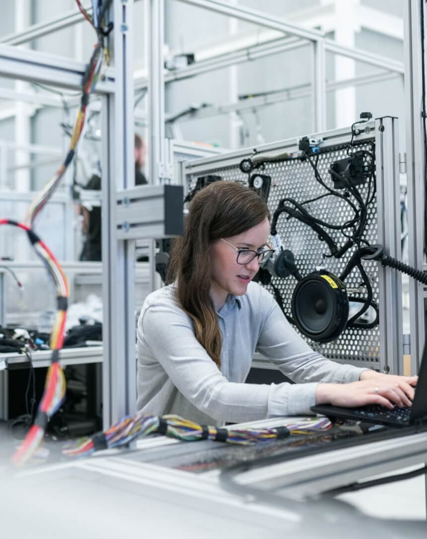 An engineer working at an instrumented test bench
